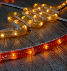FOOTBALL ORANGE & WHITE LED CORDED PLUG IN WALL ROPE LIGHT 11×19″